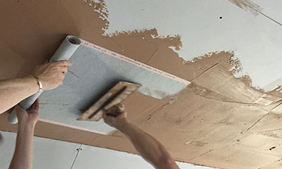 plastering the heating film into the skim